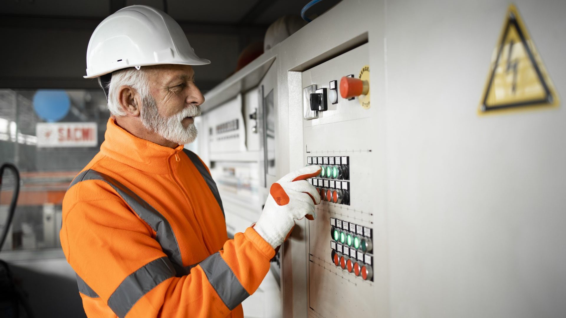 Construction worker looking at manual system.
