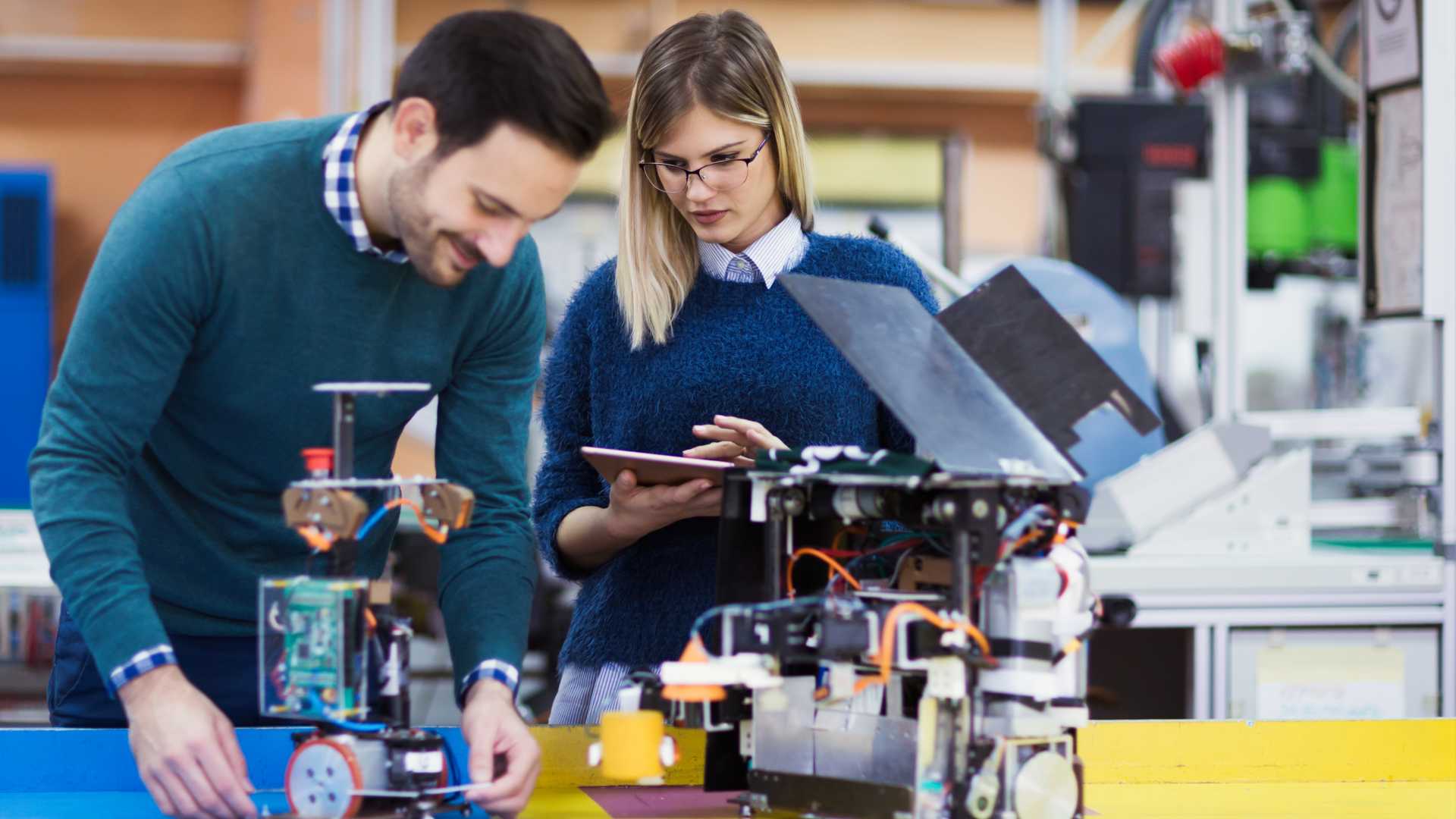 People building a robot.