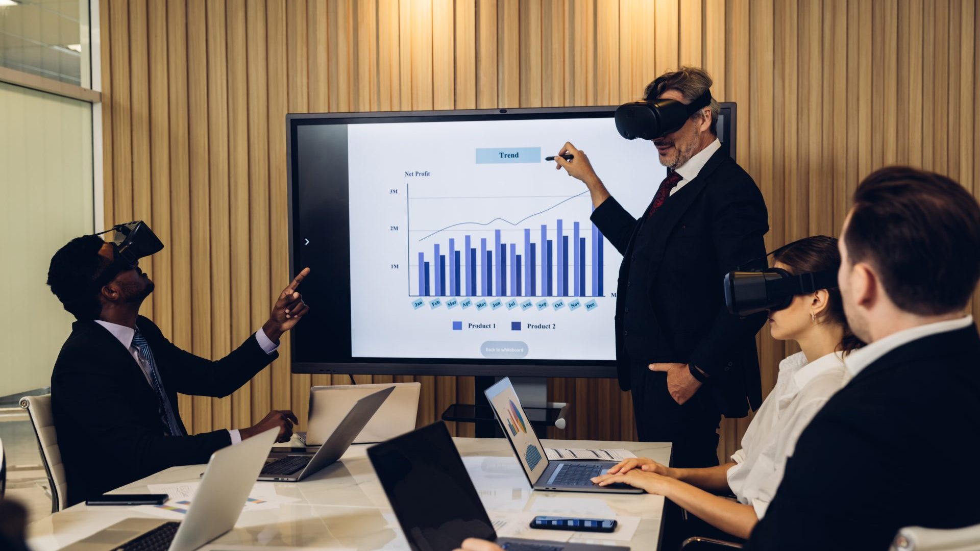 People using VR headsets in their team meetings.