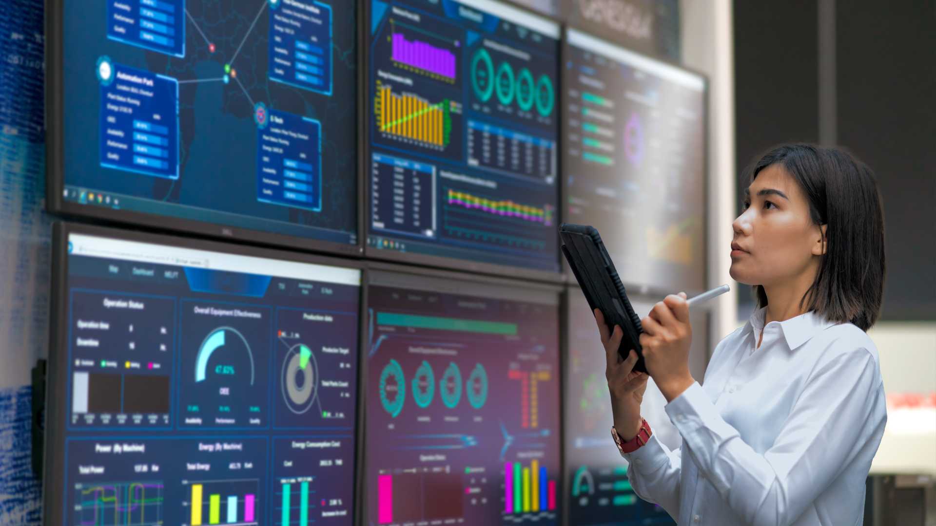 Woman looking at digital charts.