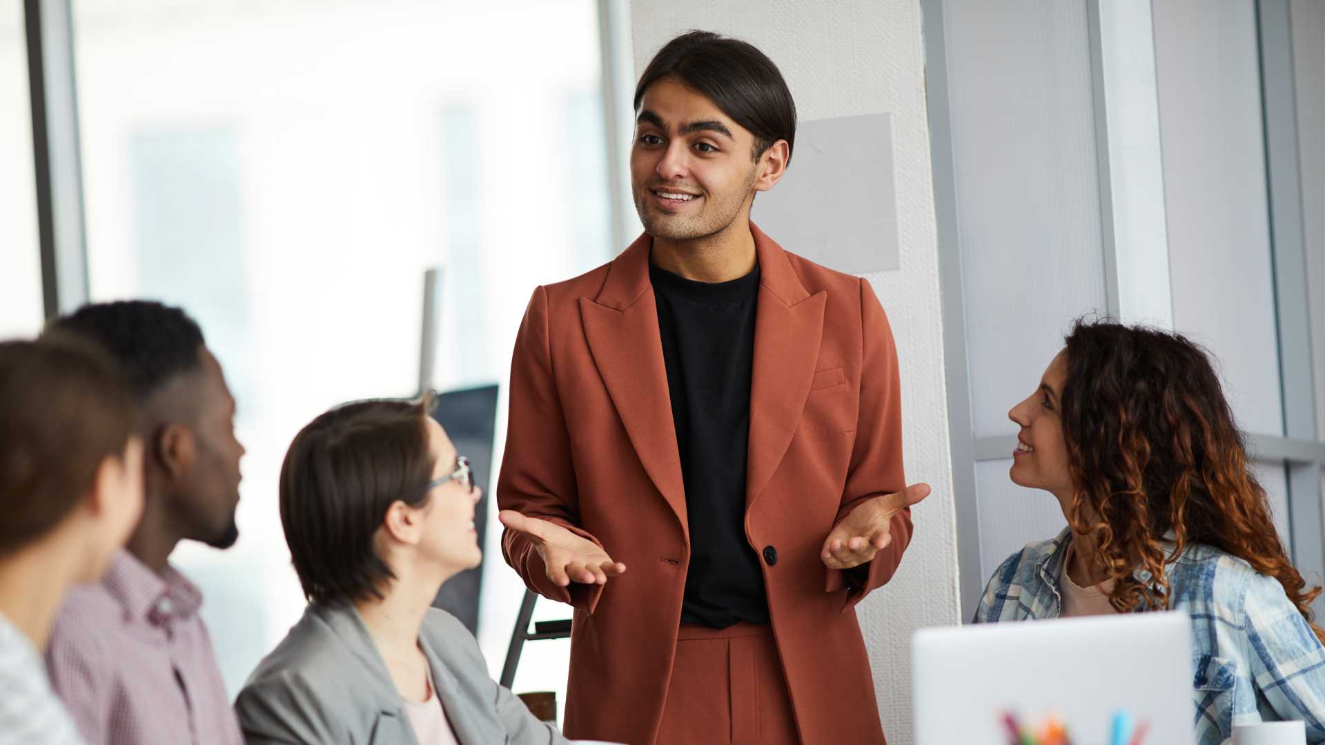 Man leading a team meeting.