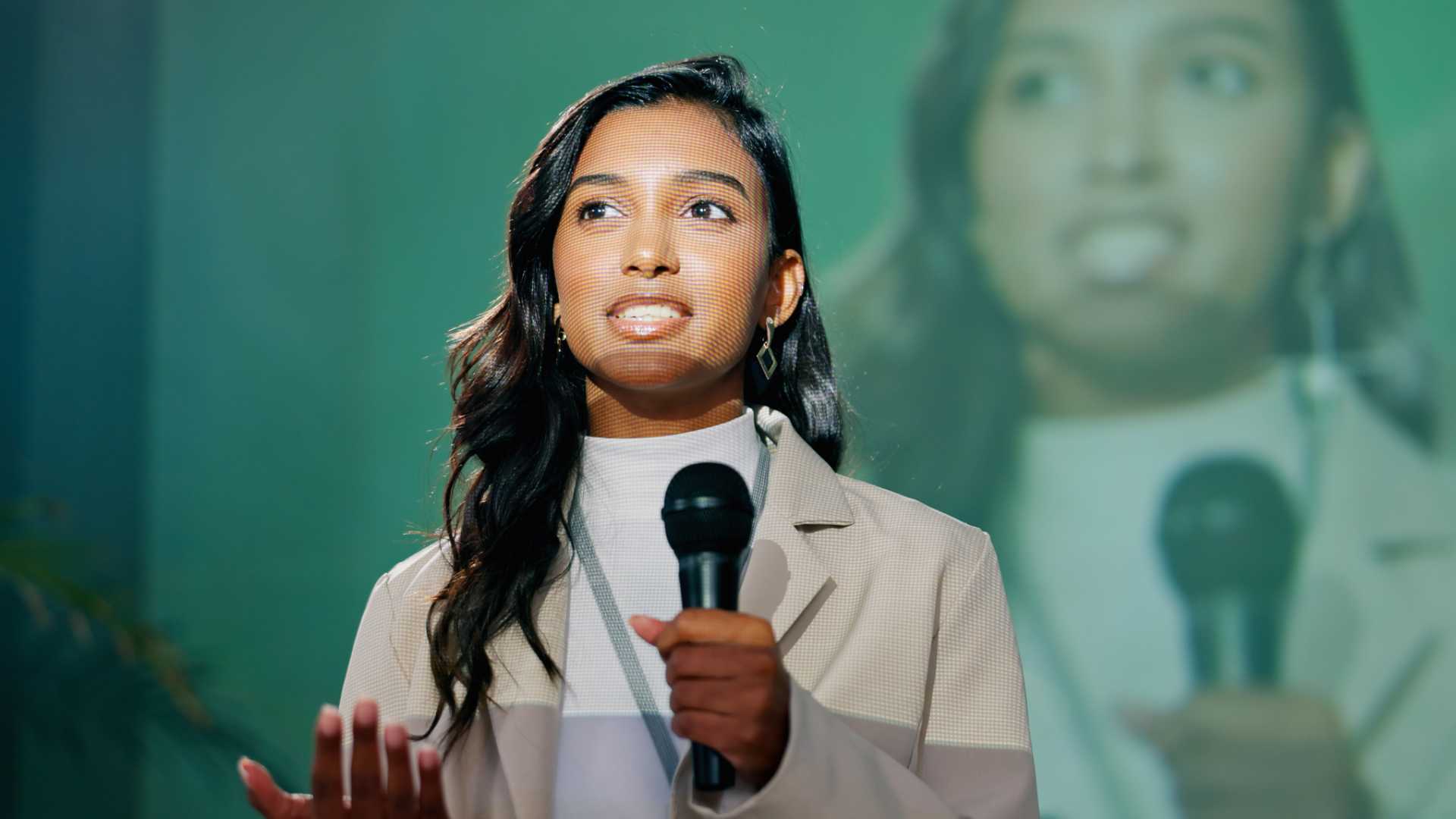 Woman giving a speech to an audience.