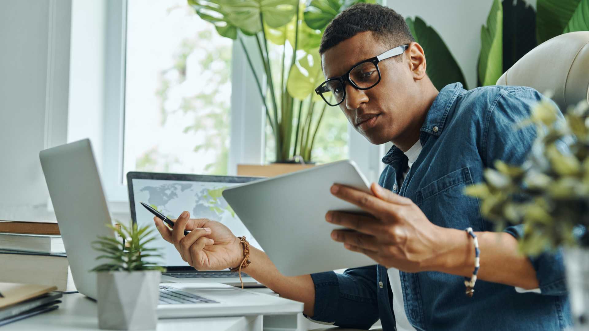 Man looking at a document for work.