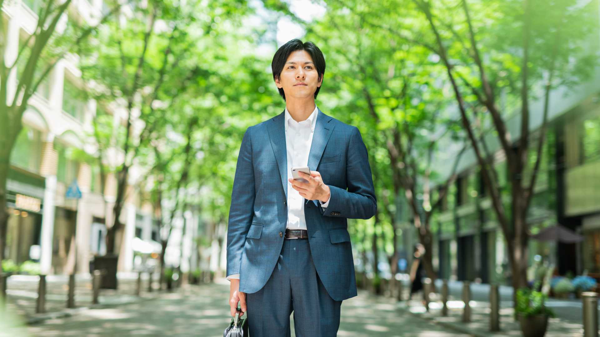 Man walking through the greenery.