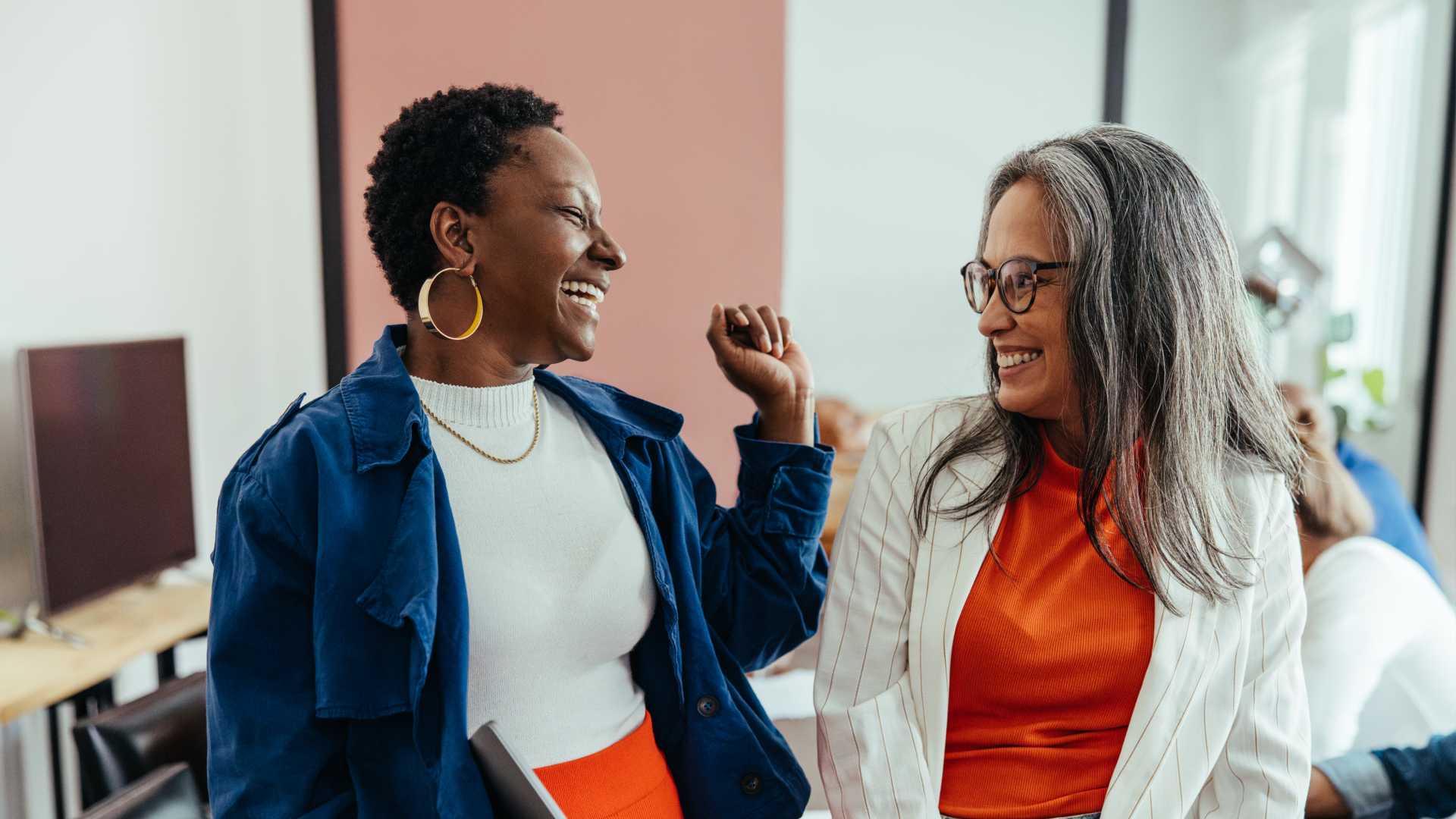 Two Two-woman collaborating with each other.