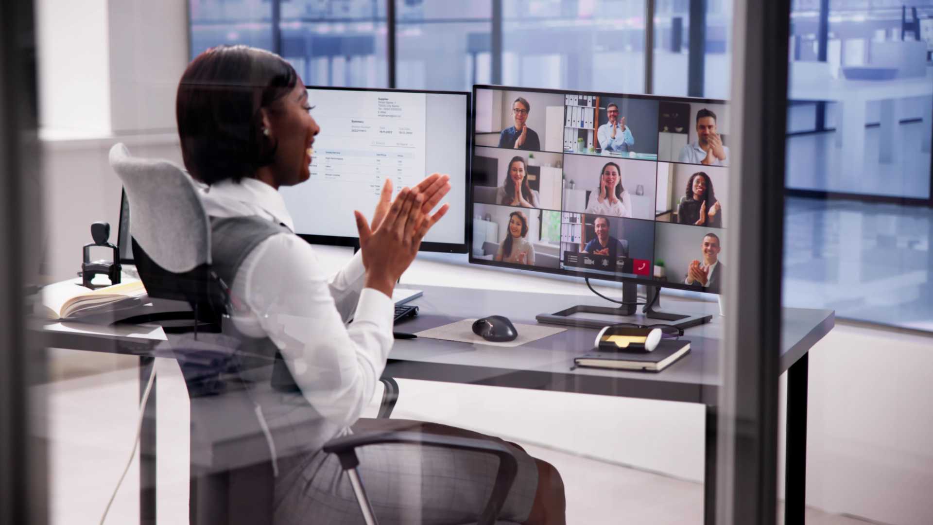Woman in a meeting with remote workers.