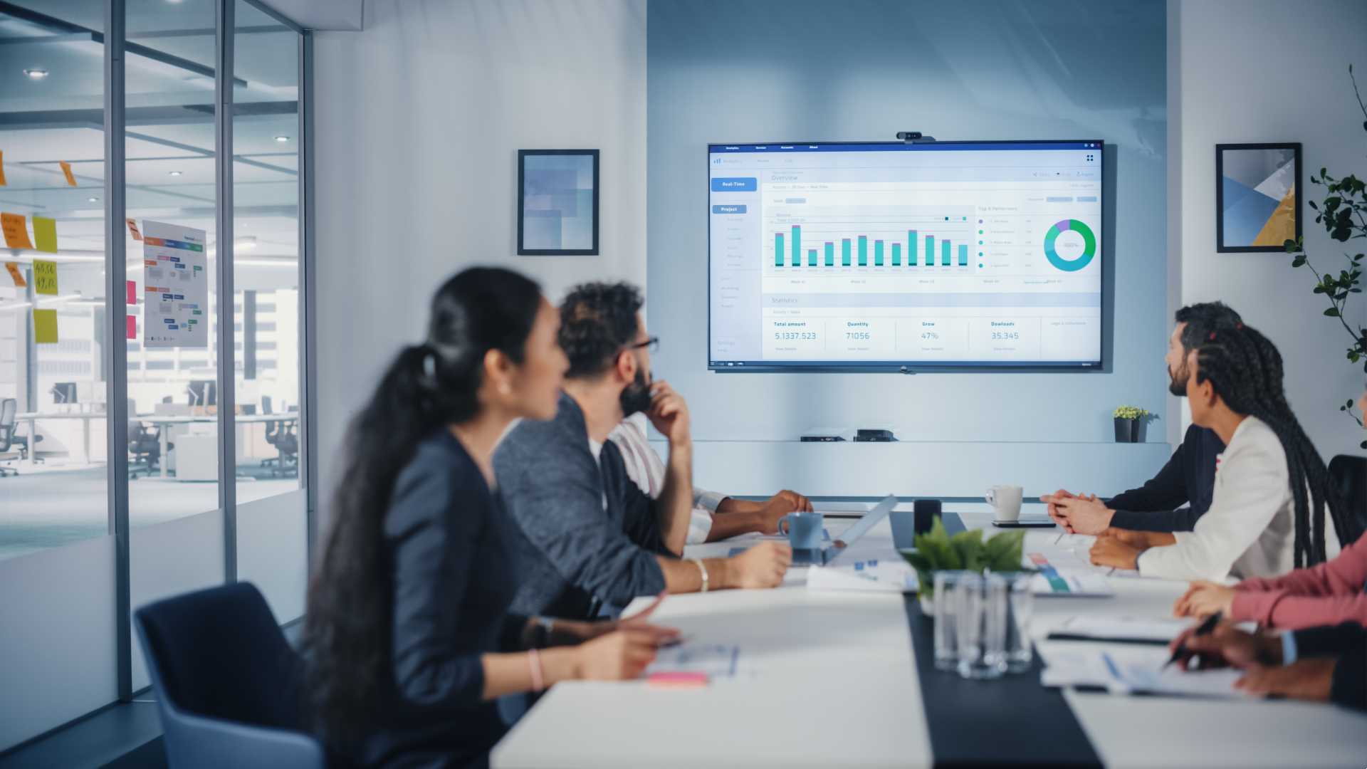 A team meeting looking at data.