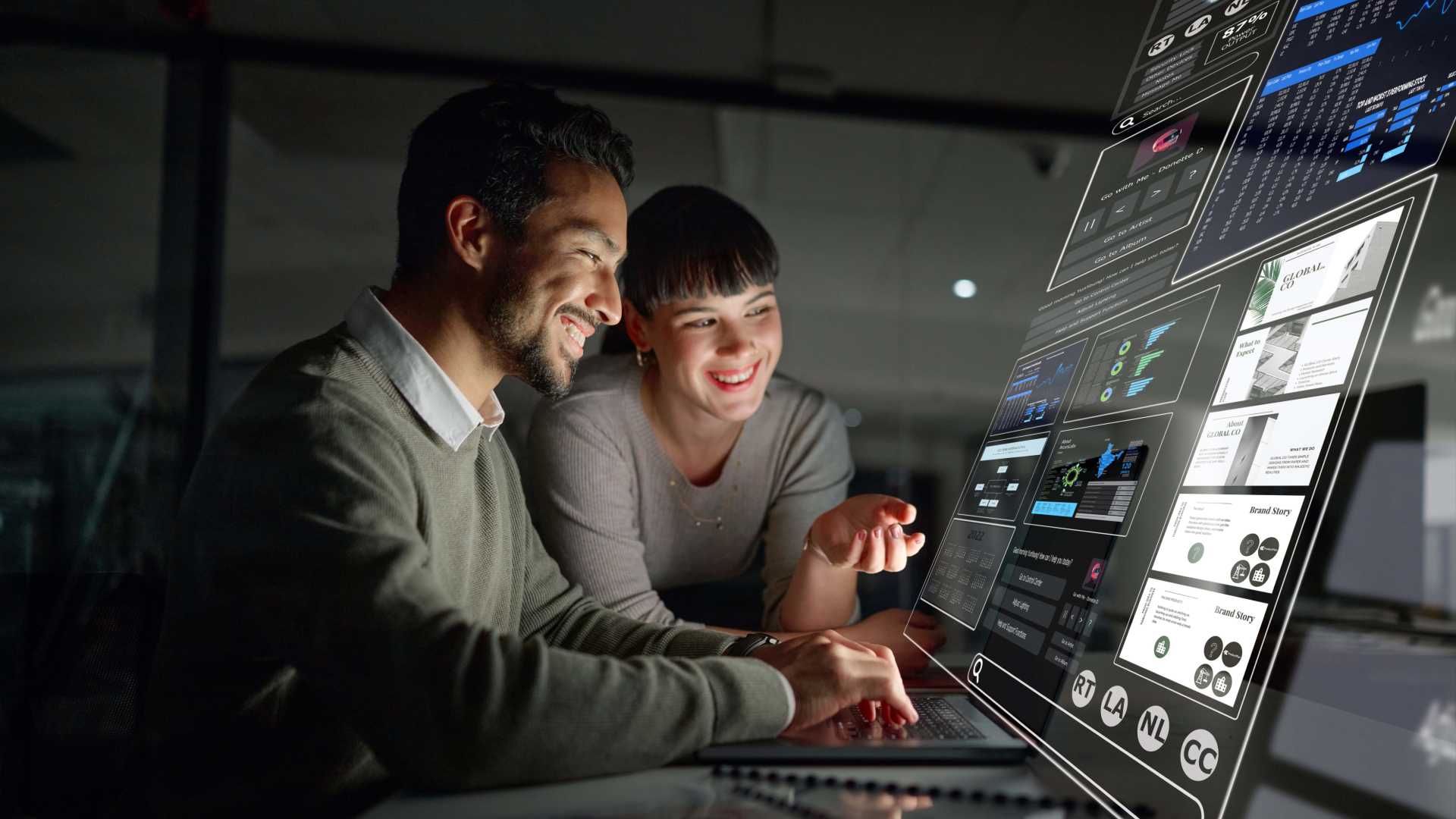 Two coworkers looking a digital workplace.