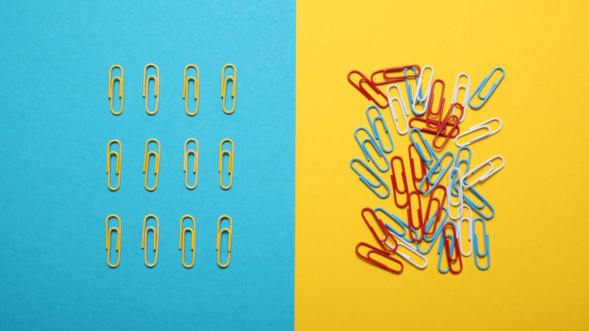 Duo-chromatic page with sky blue on the left and sunshine yellow on the right with multicolored paperclips in a mess on the right side and yellow paperclips in a militant succession on the left.