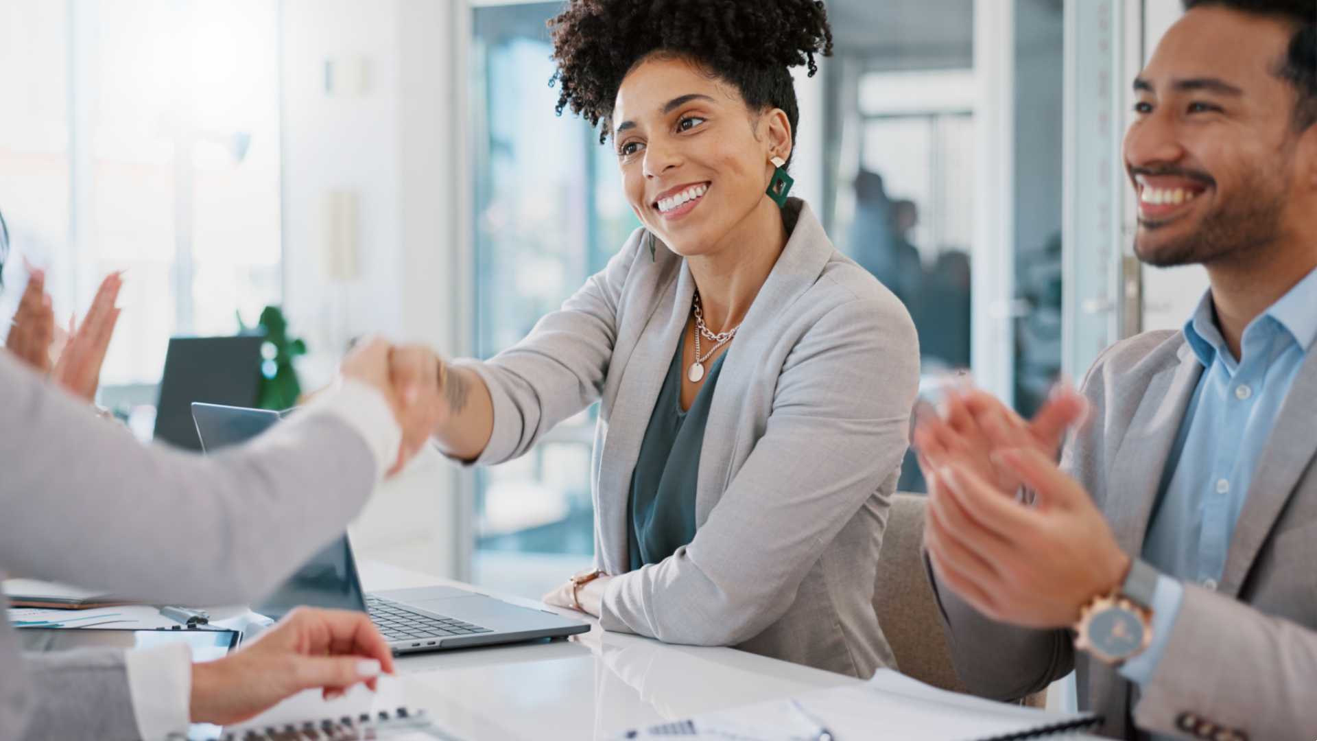 Woman shaking hands with a new potential employee.