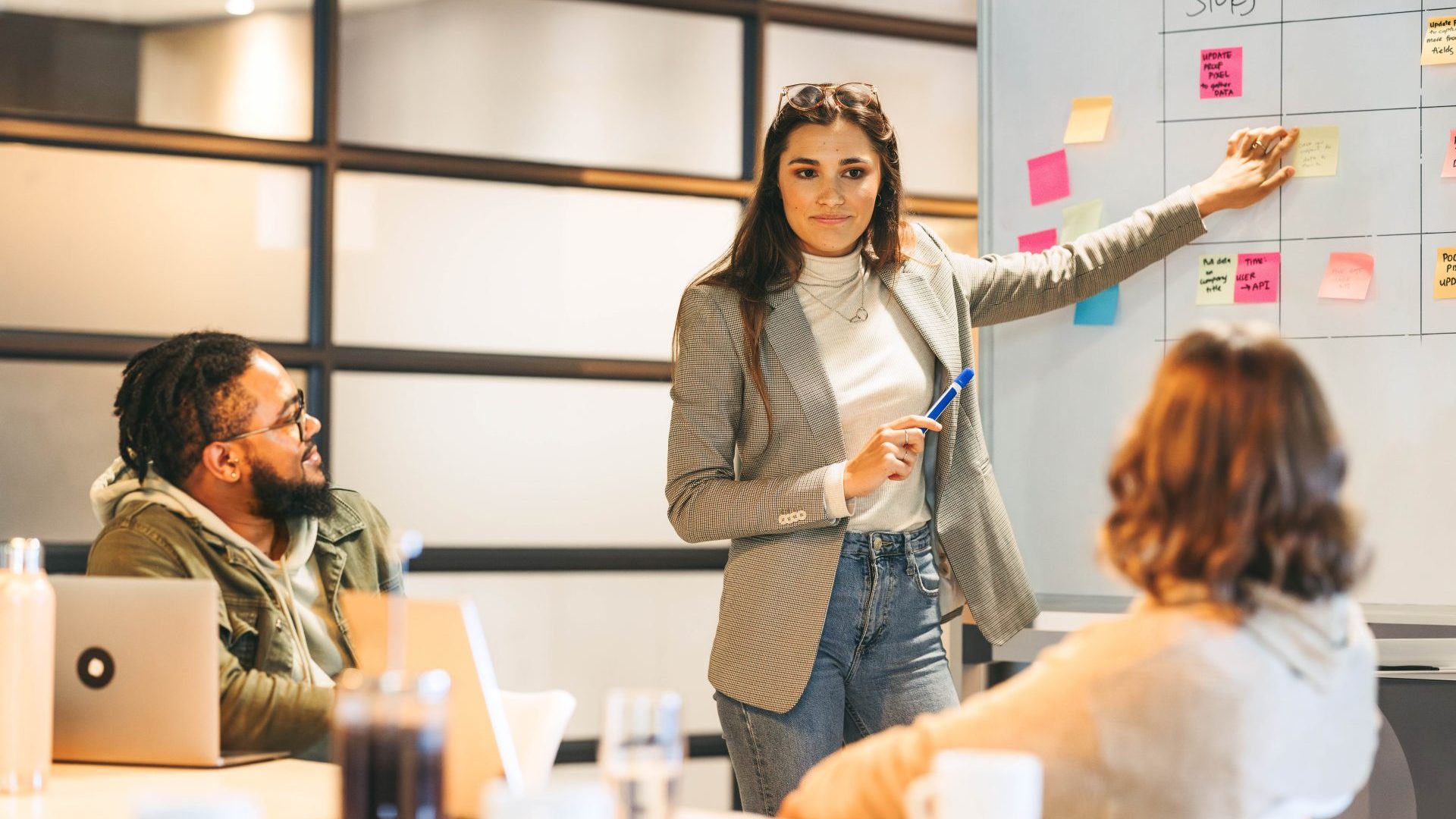Woman giving a presentation to her coworker.