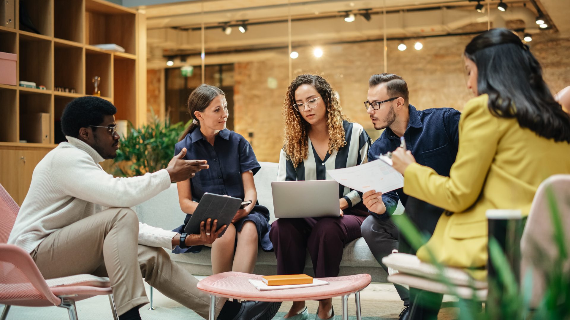 A group of people together discussing work.