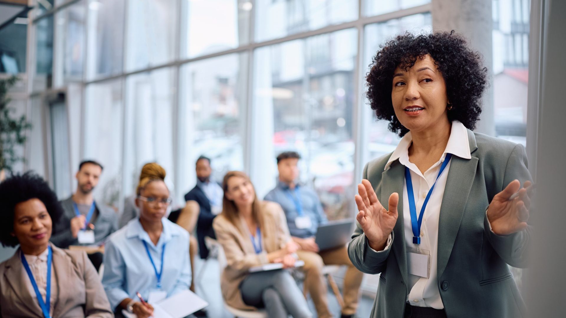 Leader giving her presentation to her coworkers.
