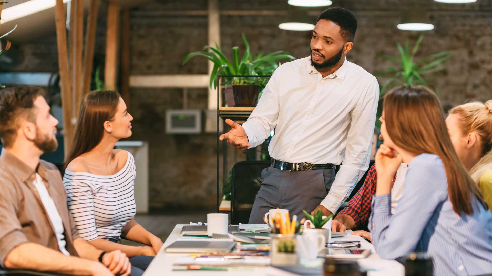 Man leading a team meeting.
