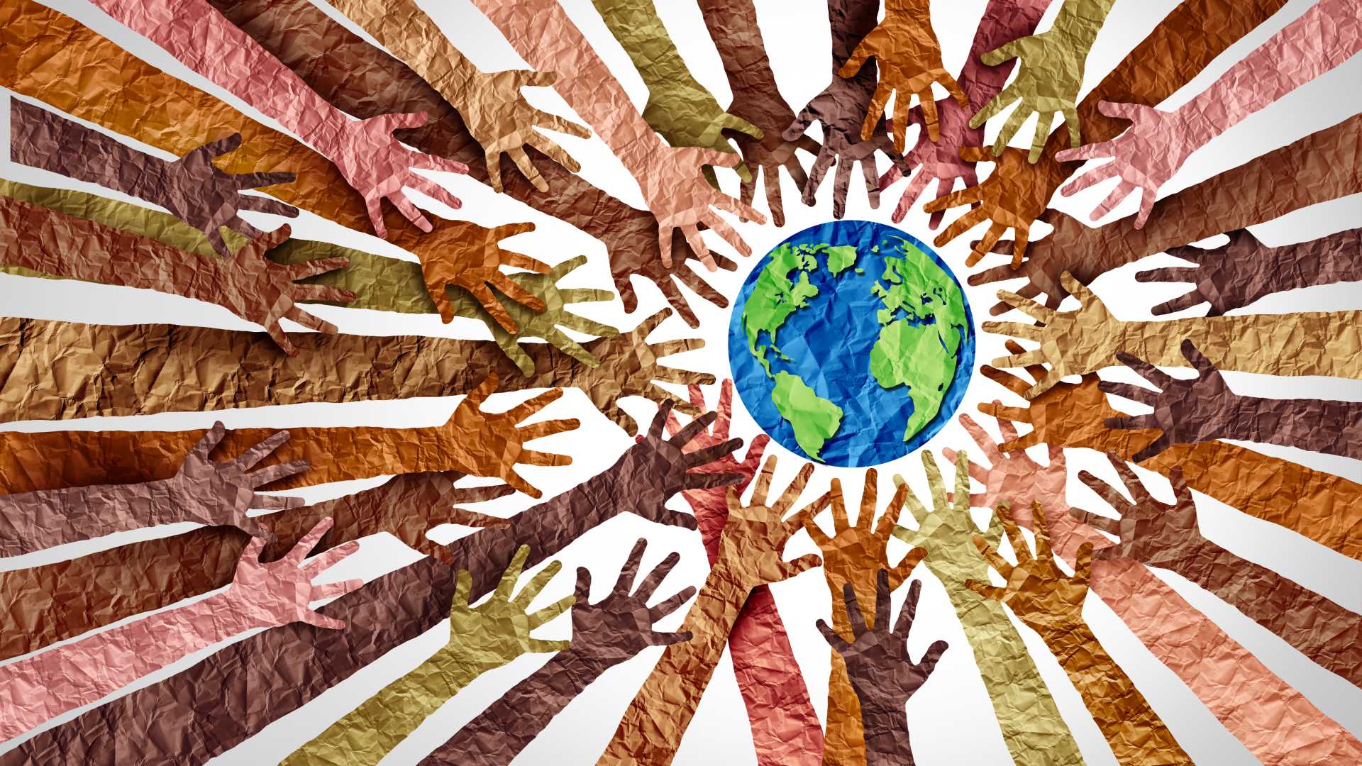 Hands all around a globe.