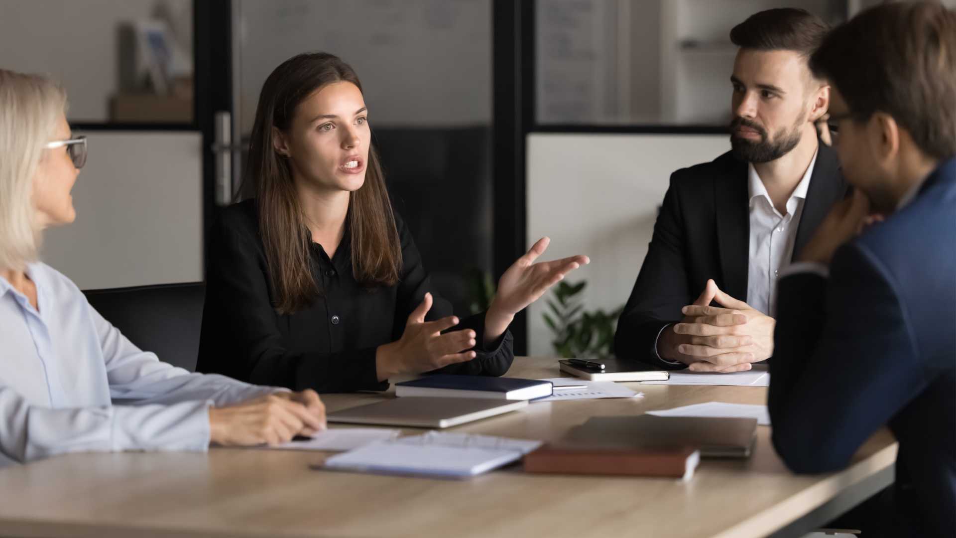 Group of people in a team meeting.