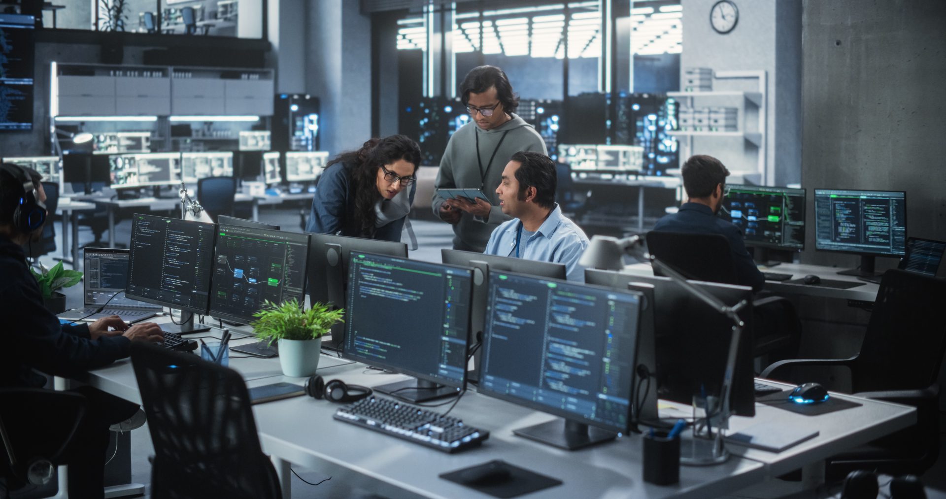 People working on computers for coding.