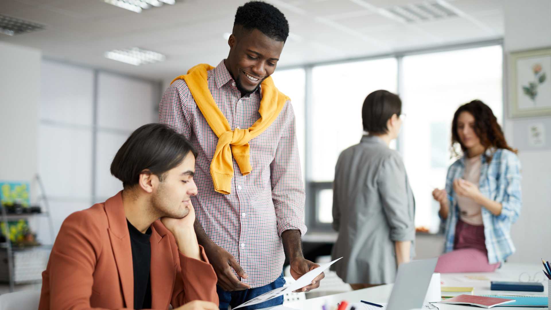 People in a team meeting for work.
