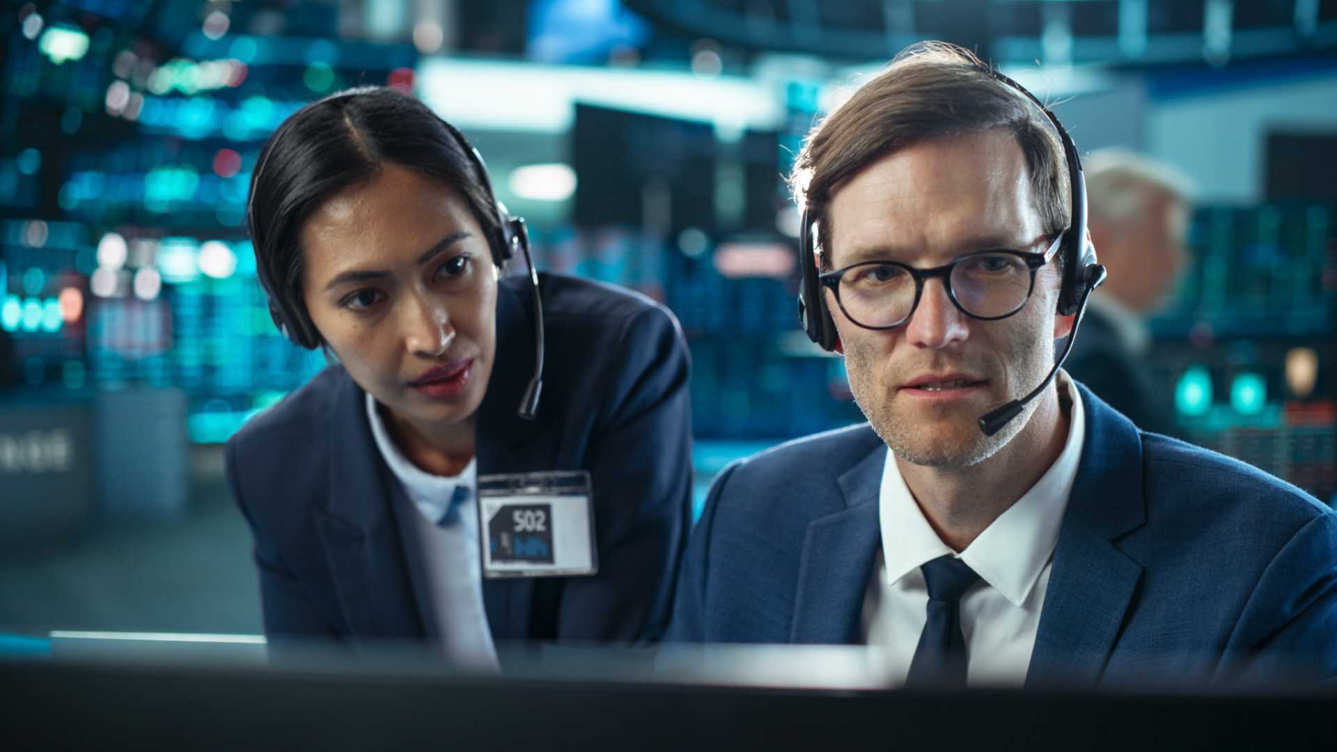 Coworkers together working through a task.