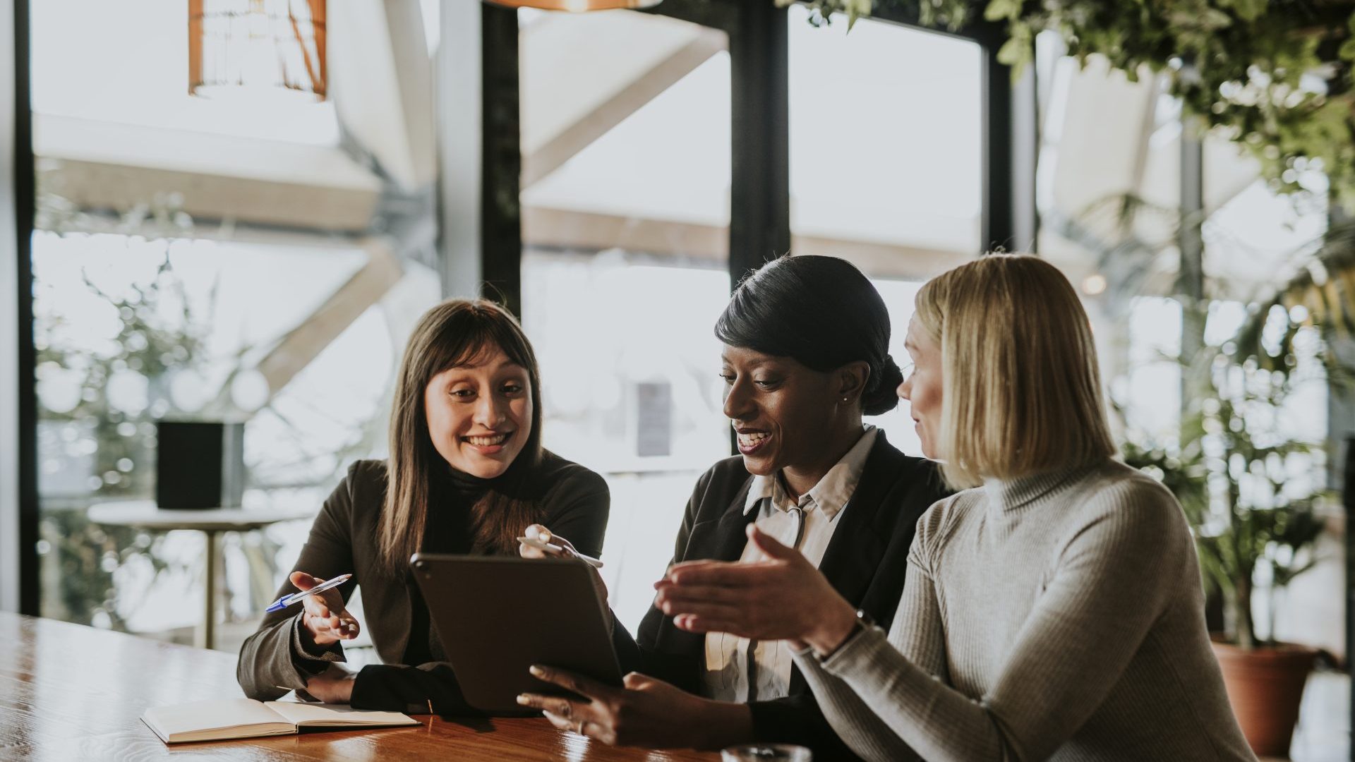 Woman working together in a cafe.