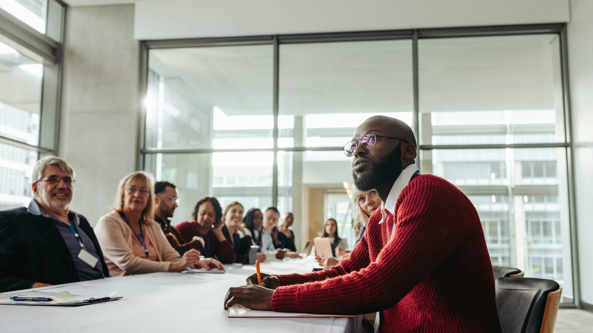 People sitting in a team meeting for work.