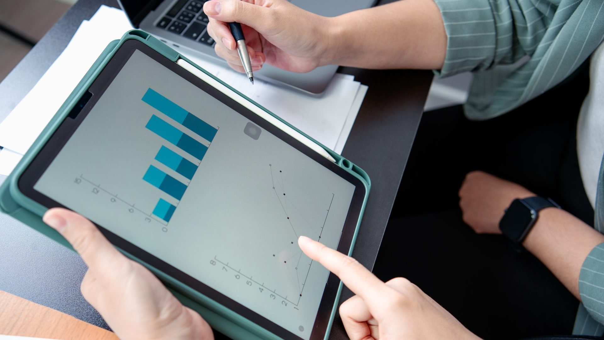 People looking at charts for work.
