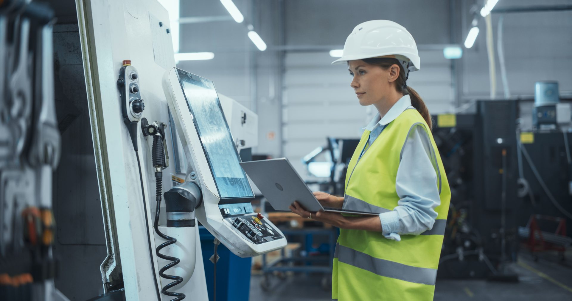 Construction worker using technology for work.