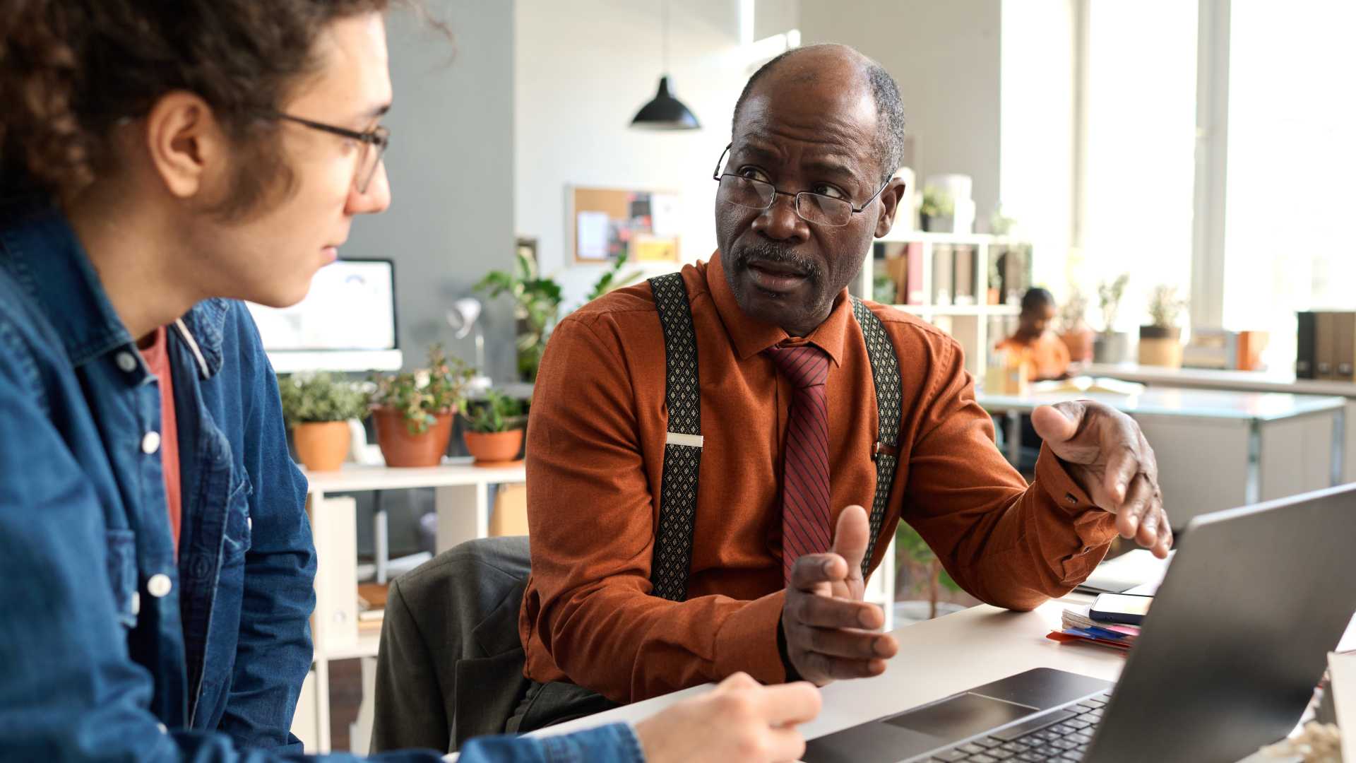 Apprentice learns alongside an experienced mentor in the workplace, illustrating work-based learning, employer-led skills development and apprenticeship training.