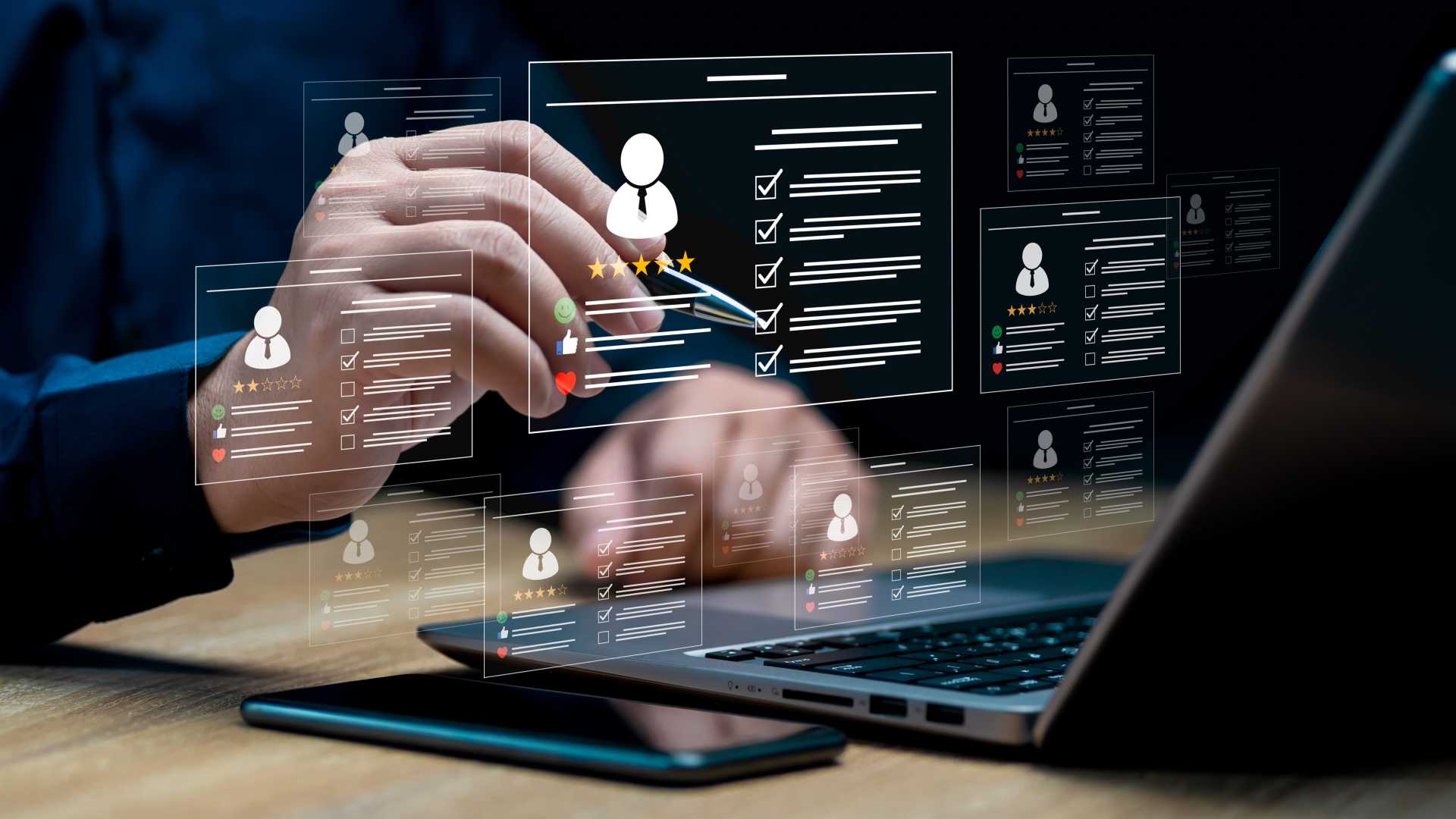 business professional reviewing digital candidate profiles and performance data on a laptop, illustrating talent evaluation, recruitment and workforce management.