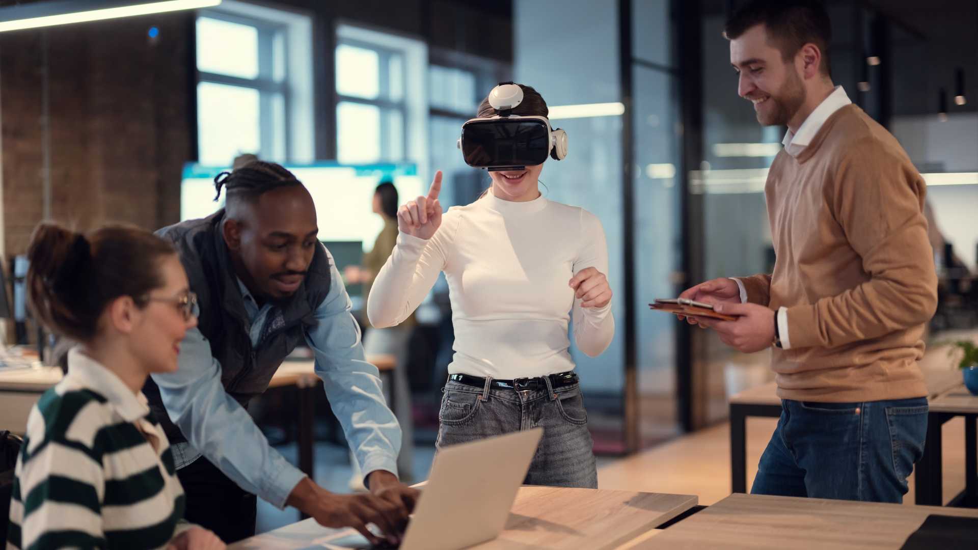 Employees participate in a virtual reality training session while colleagues observe, illustrating immersive learning, hands-on skill development and performance-based VR training.