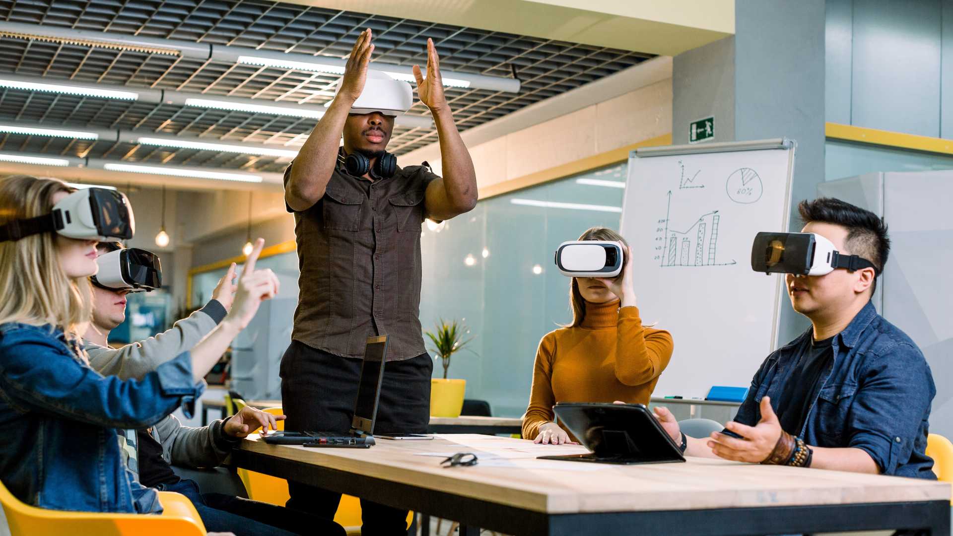 Employees wearing VR headsets during an immersive workplace training session.