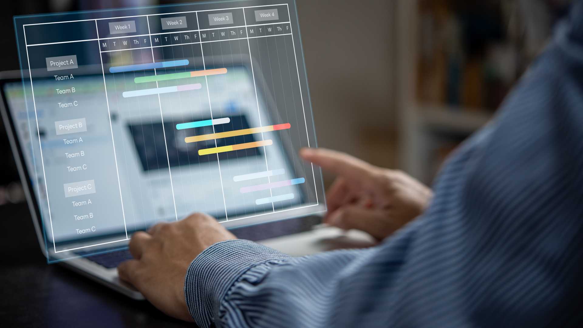 L&D professional reviewing a digital planning dashboard, illustrating how learning technology platforms structure, organize and measure workplace learning activities.