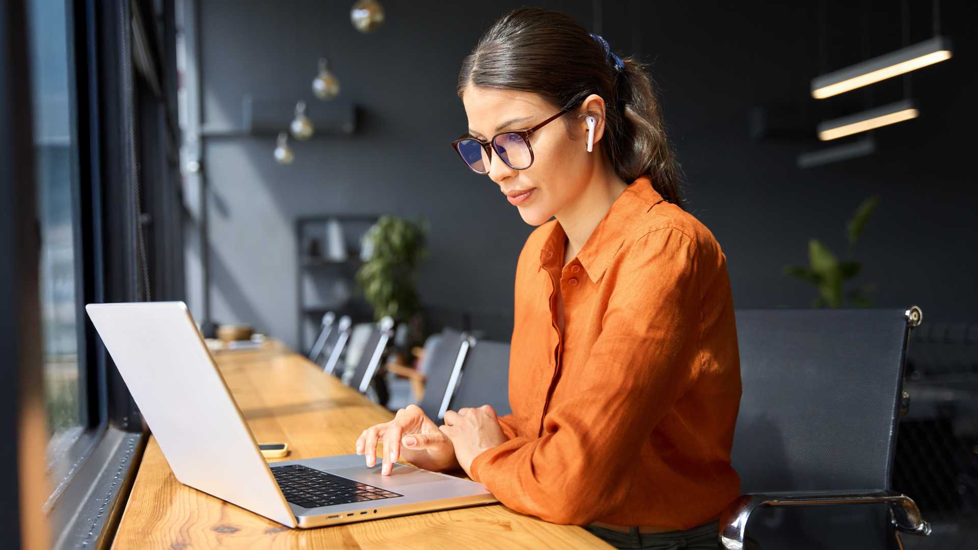 Professional completing online training on a laptop, illustrating digital learning, skill development and technology-enabled workplace training.
