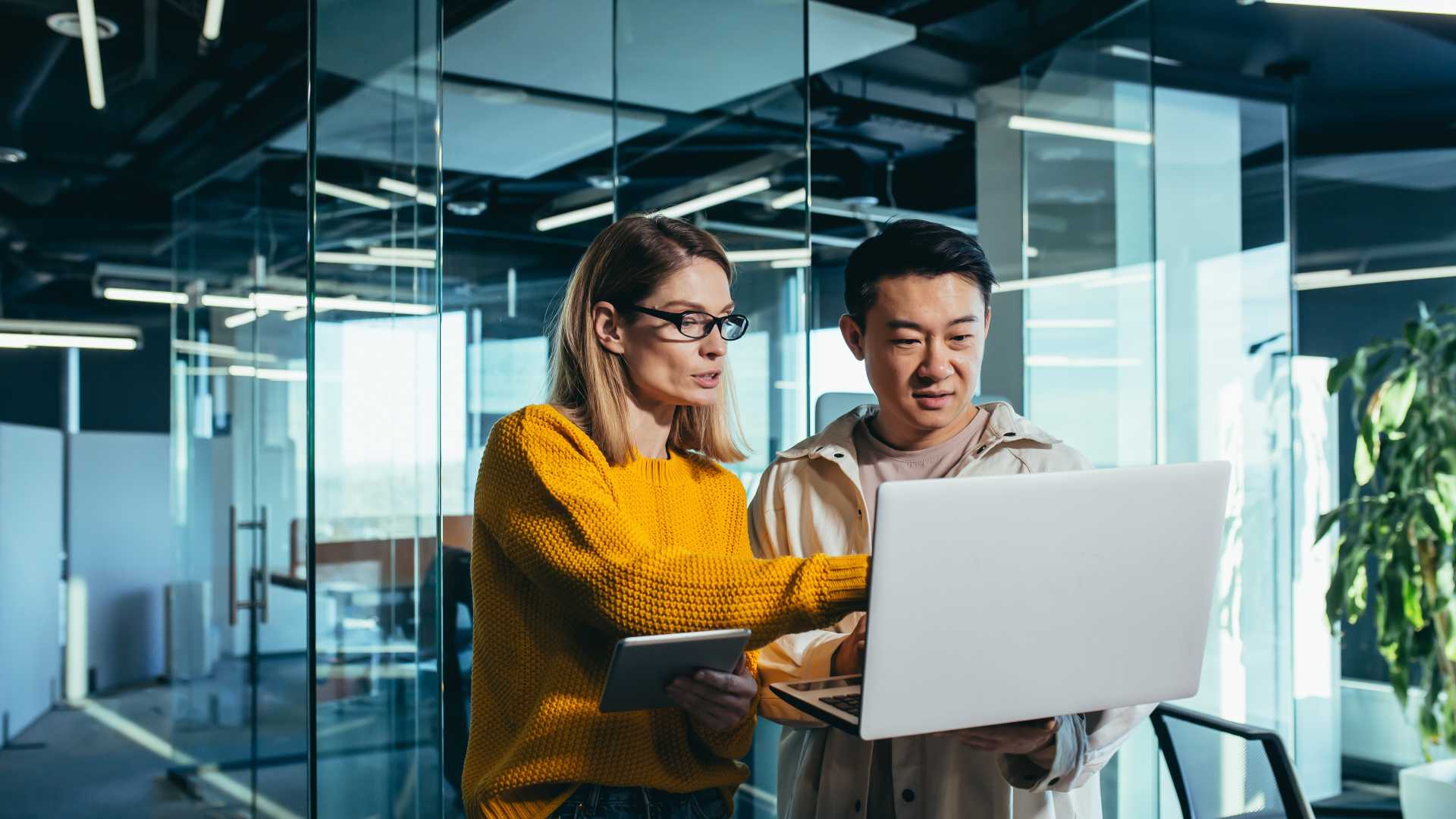 Business professionals reviewing performance data, illustrating how organizations can measure AI pilot outcomes and evaluate the impact of AI on workplace performance.